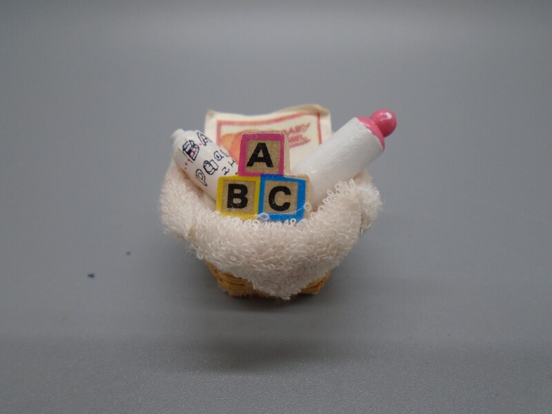 BABY/NURSERY ITEMS IN WOVEN BASKET