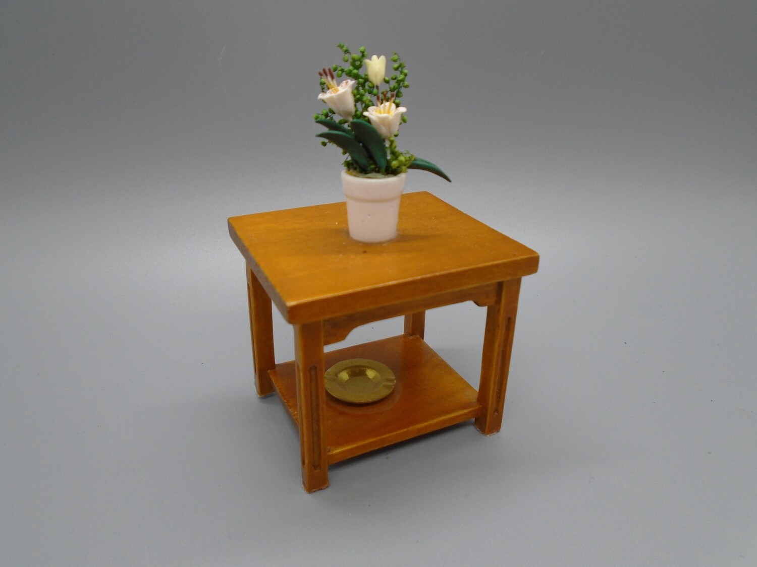 SIDE TABLE WITH PLANT AND ASHTRAY