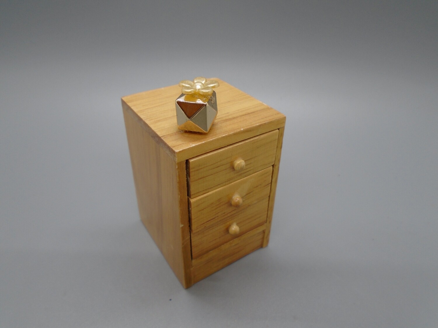 BEDSIDE DRAWERS WITH PERFUME BOTTLE