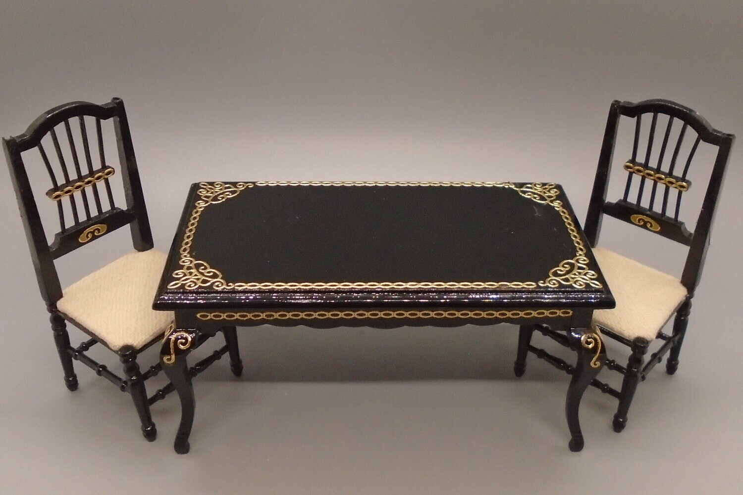 BLACK AND GOLD TABLE AND 2 CHAIRS