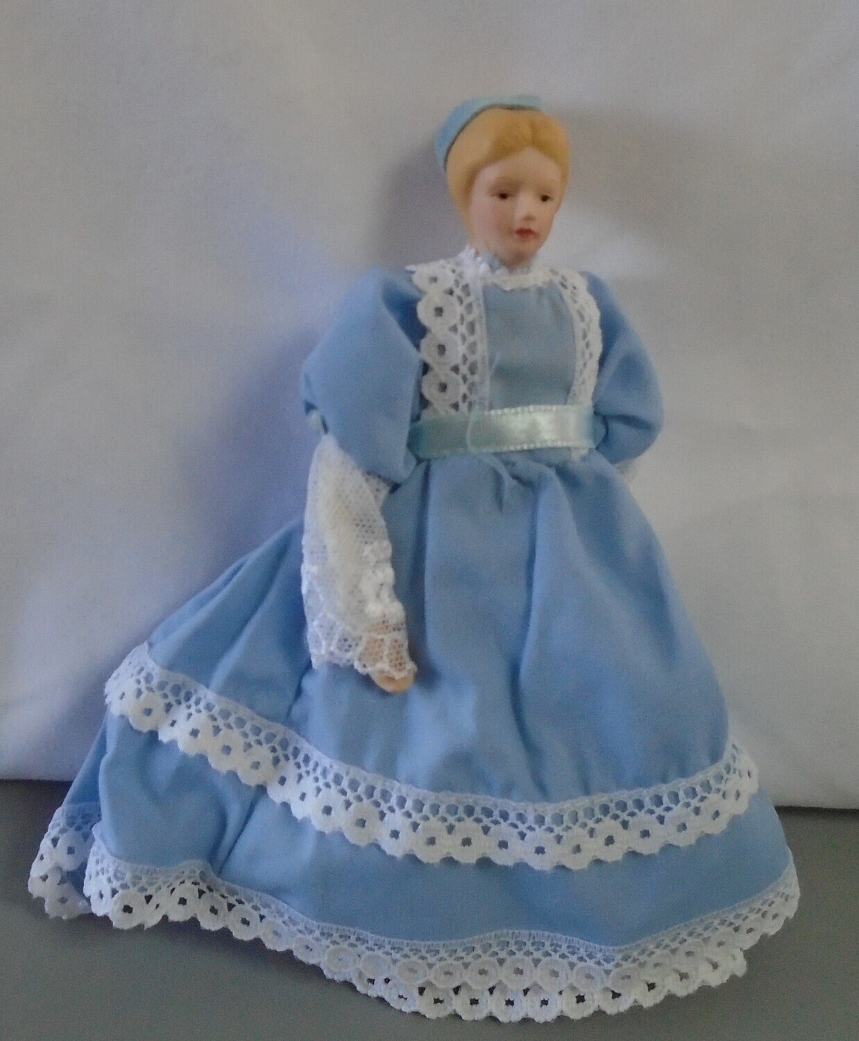 LADY IN LIGHT BLUE DRESS WITH LACE