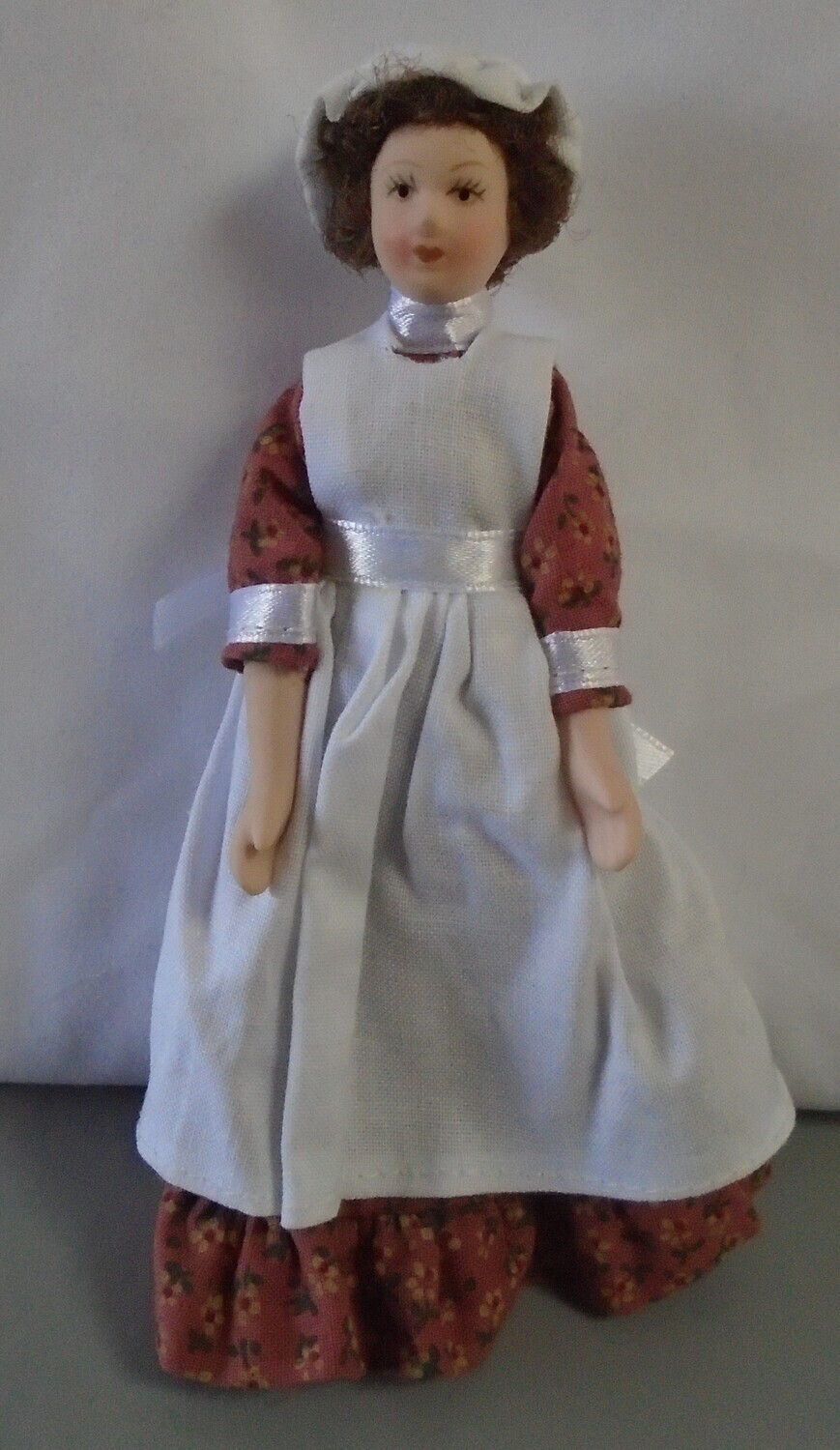 MAID IN RUST FLORAL DRESS