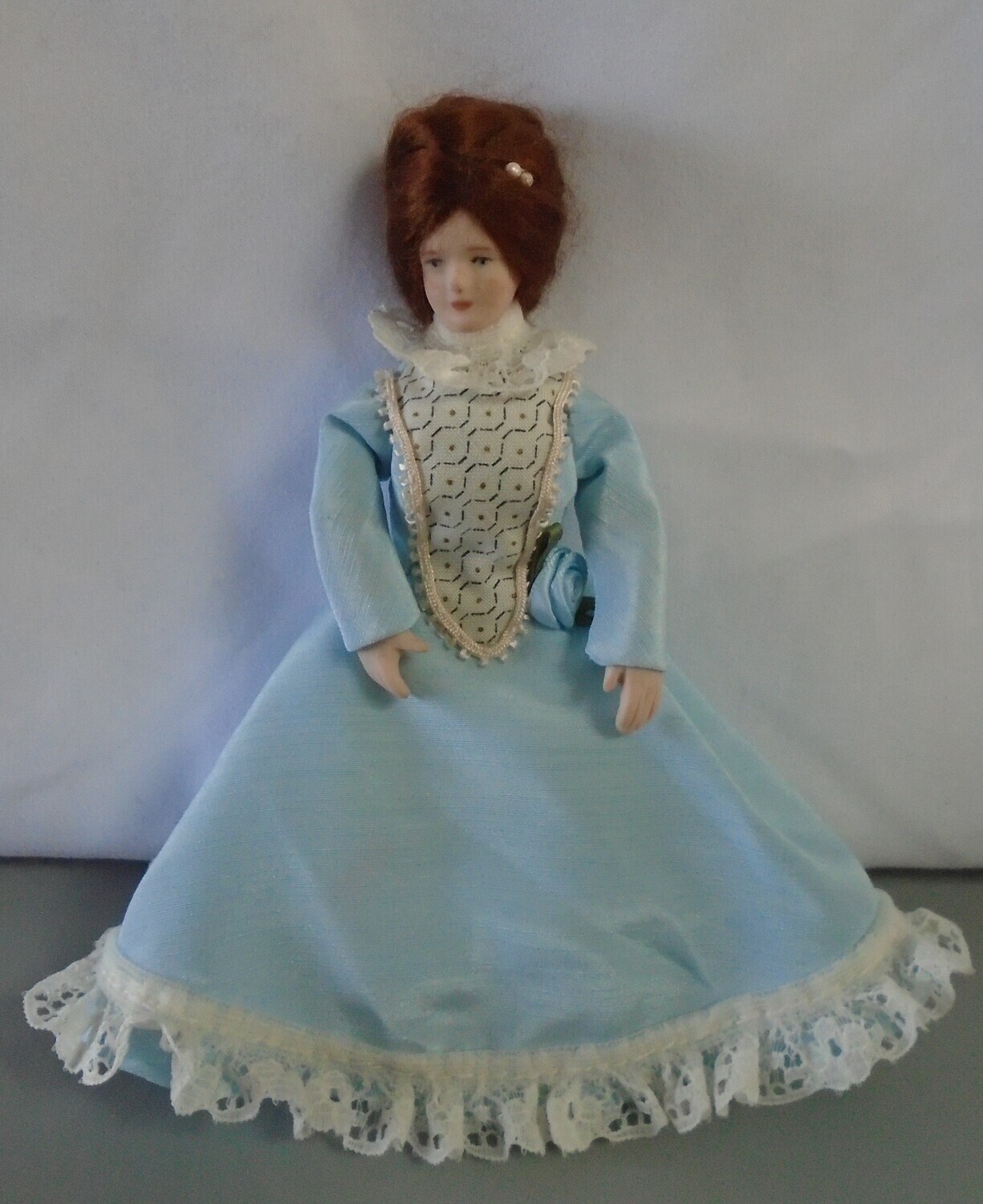 LADY IN BLUE WITH HAIR DECORATION