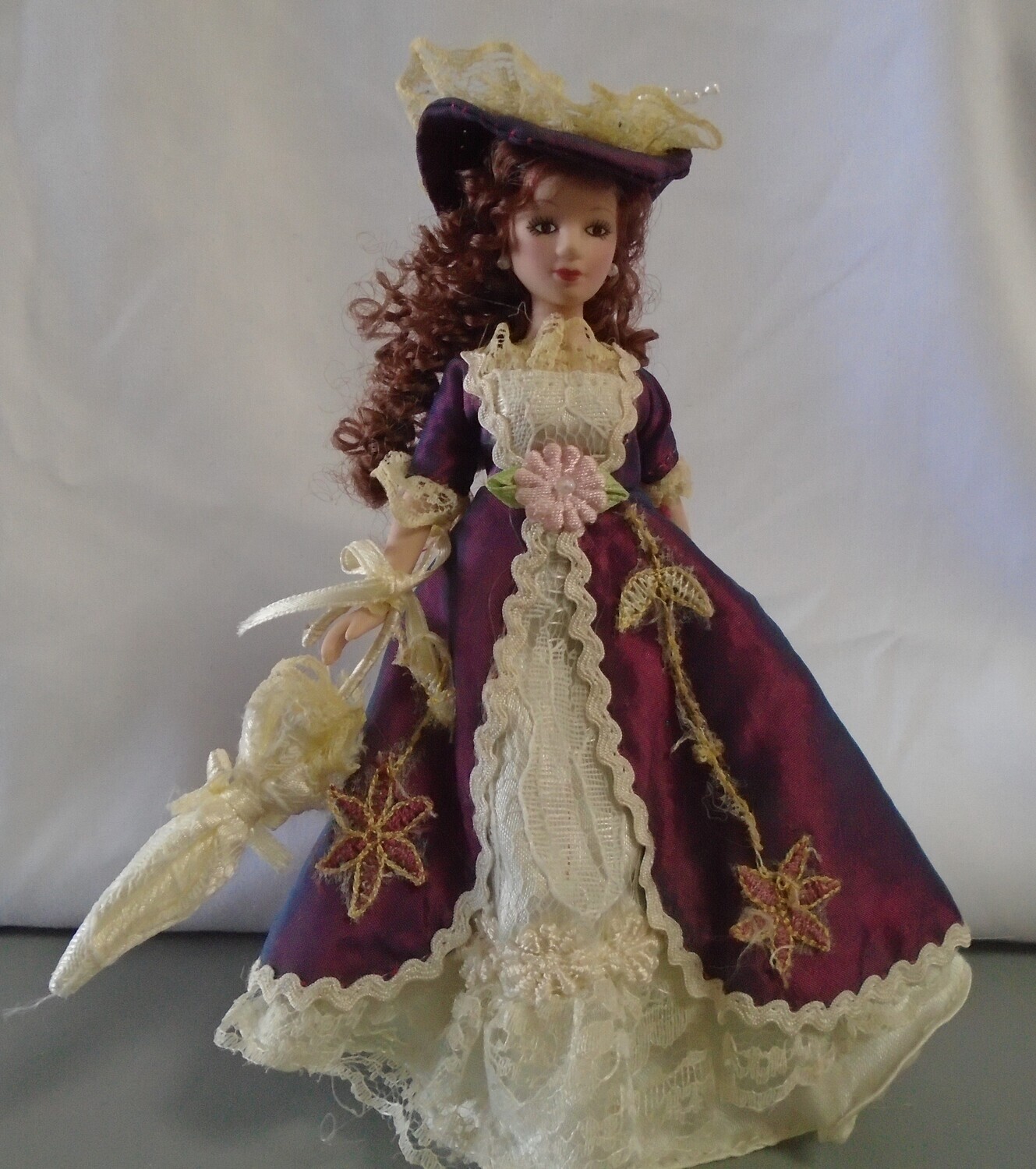 LADY IN PURPLE DRESS AND HAT