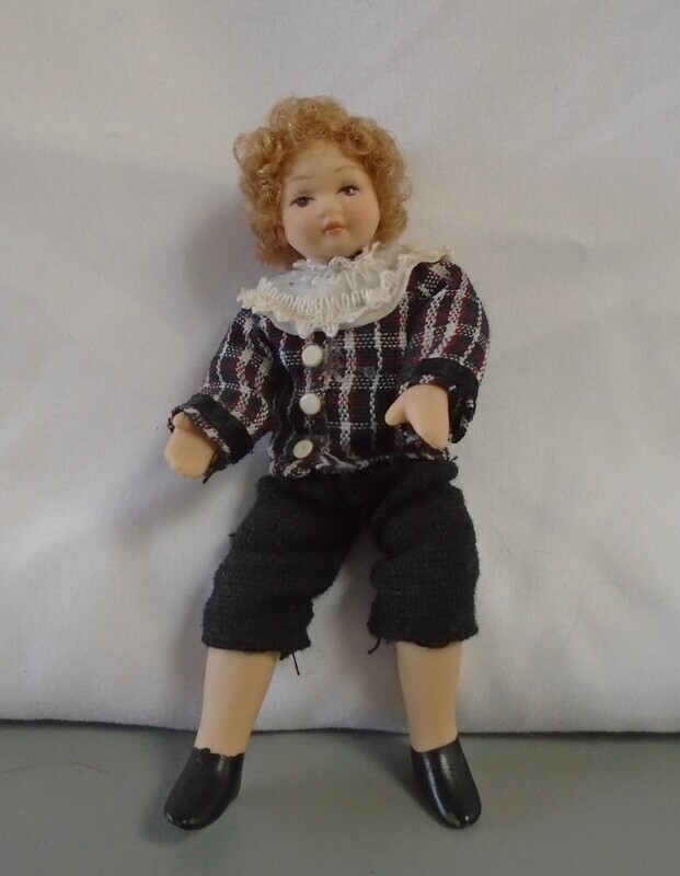 BOY IN SHORTS AND CHECK SHIRT
