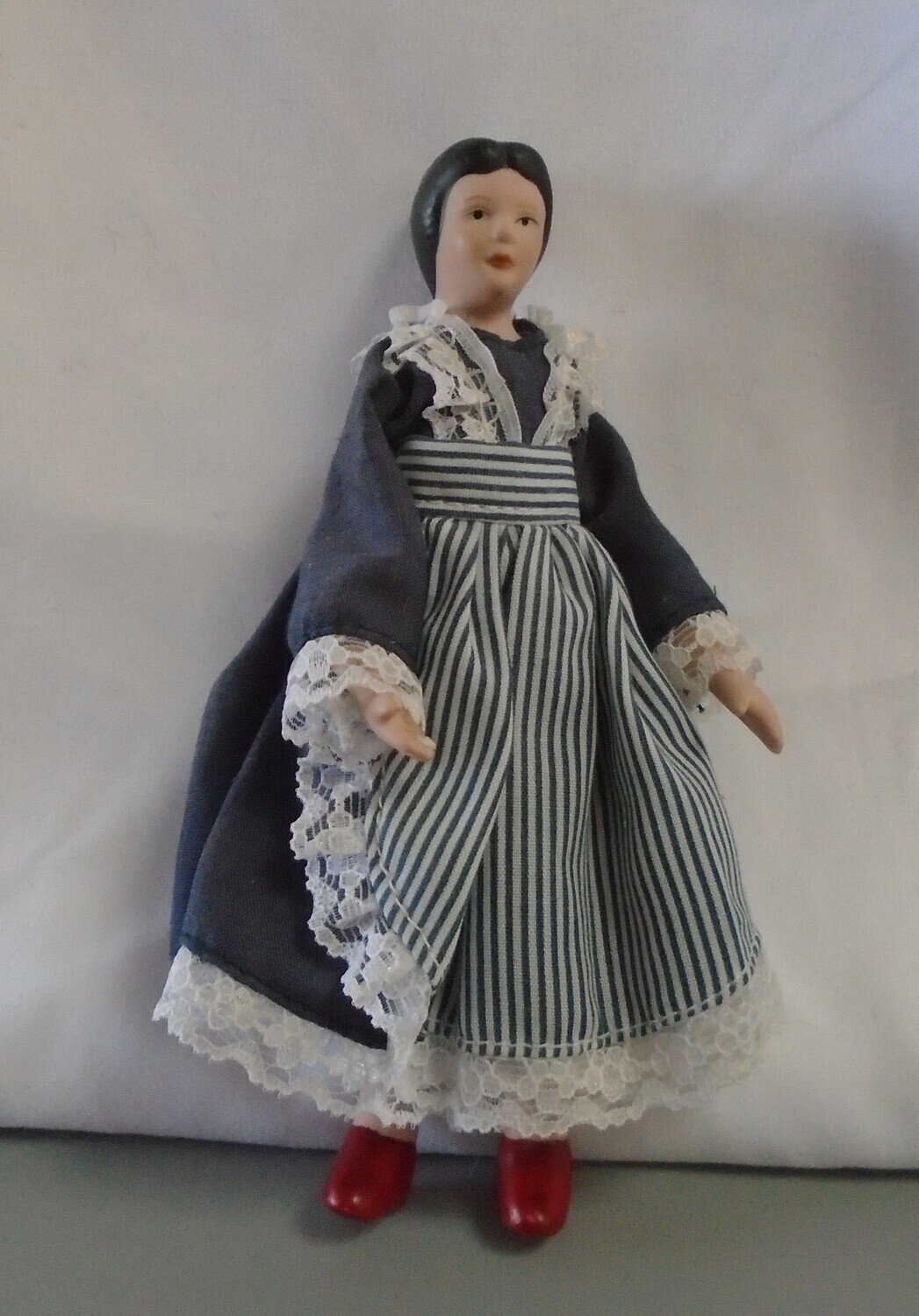 LADY IN NAVY AND STRIPE APRON