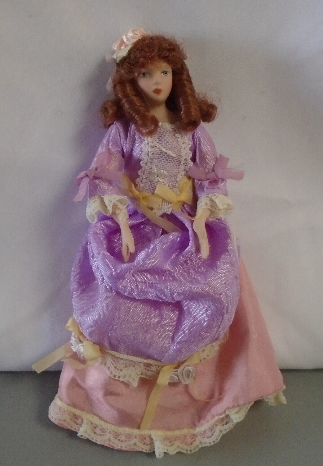 LADY IN LILAC AND PINK DRESS