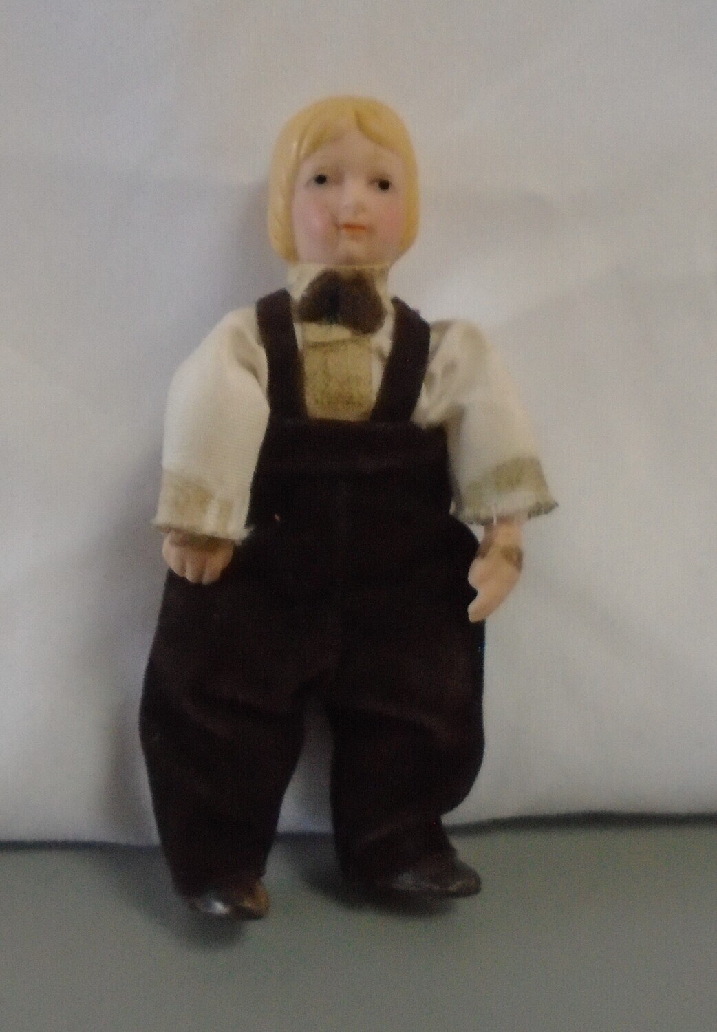VINTAGE BOY IN BROWN TROUSERS