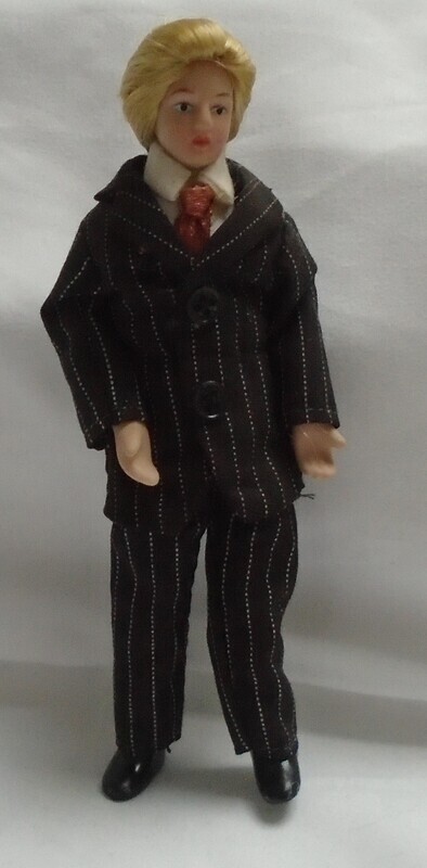 MAN IN BROWN STRIPE SUIT WITH BLONDE HAIR