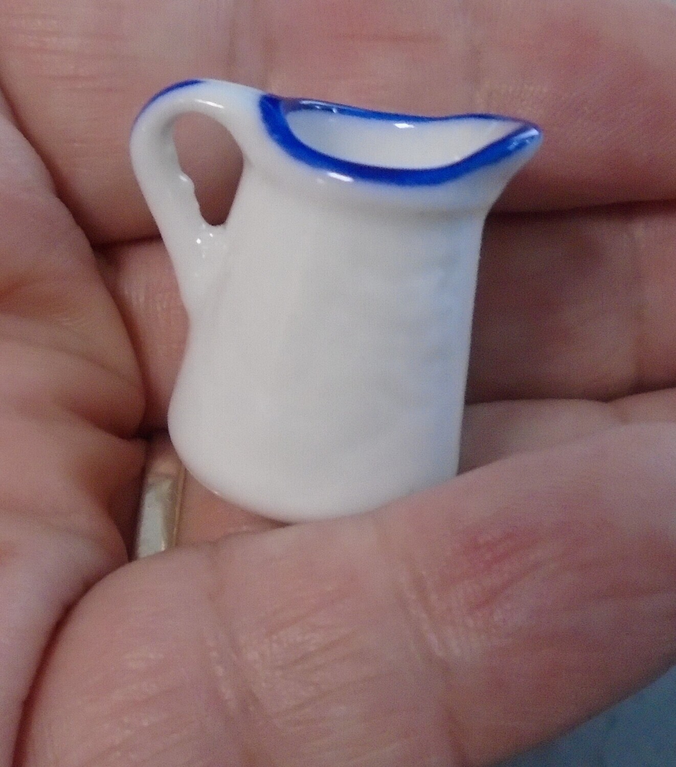WHITE JUG WITH BLUE RIM