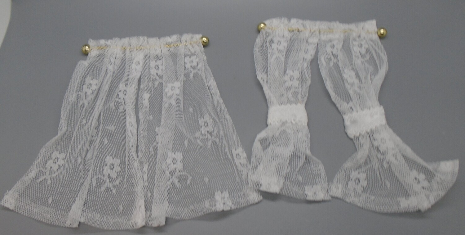 NET CURTAINS ON GOLD COLOUR POLE