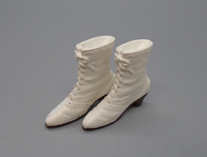 PAIR OF WHITE LACE UP BOOTS