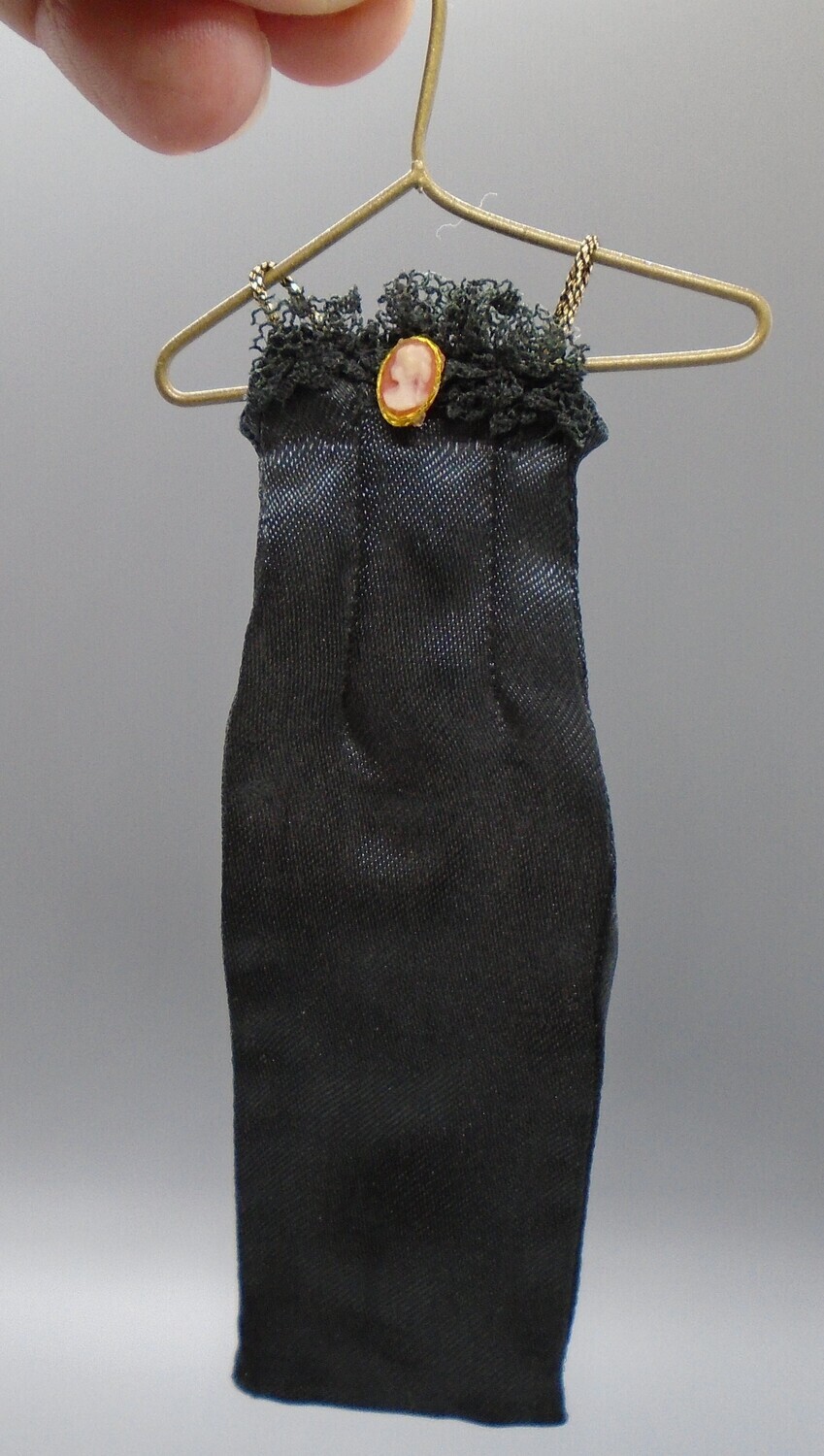 BLACK DRESS WITH CAMEO ON HANGER BLACK DRESS WITH CAMEO ON HANGER