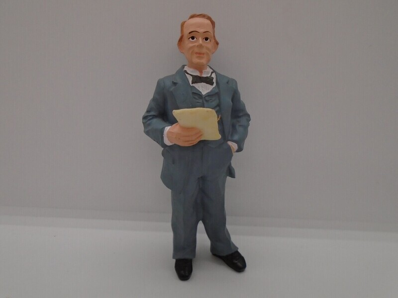 PRE-LOVED MAN STANDING IN GREY SUIT WITH LETTER
