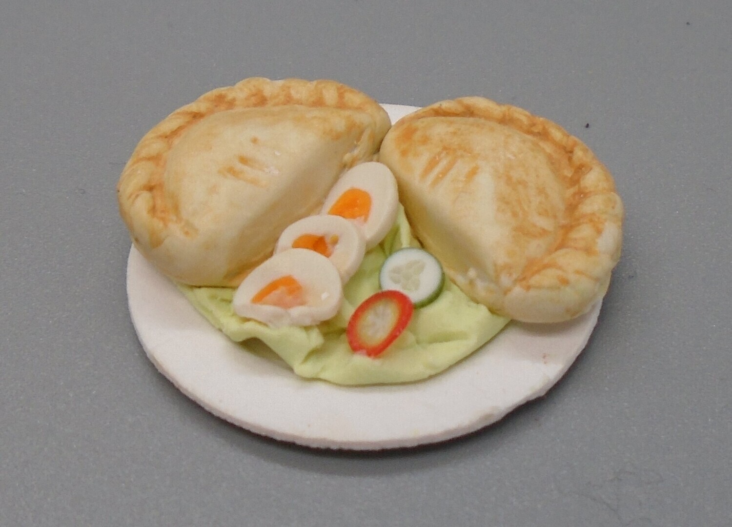 PASTIE AND SALAD ON PLATE