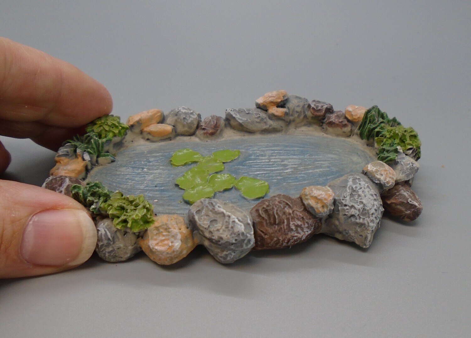 POND WITH ROCKS AROUND