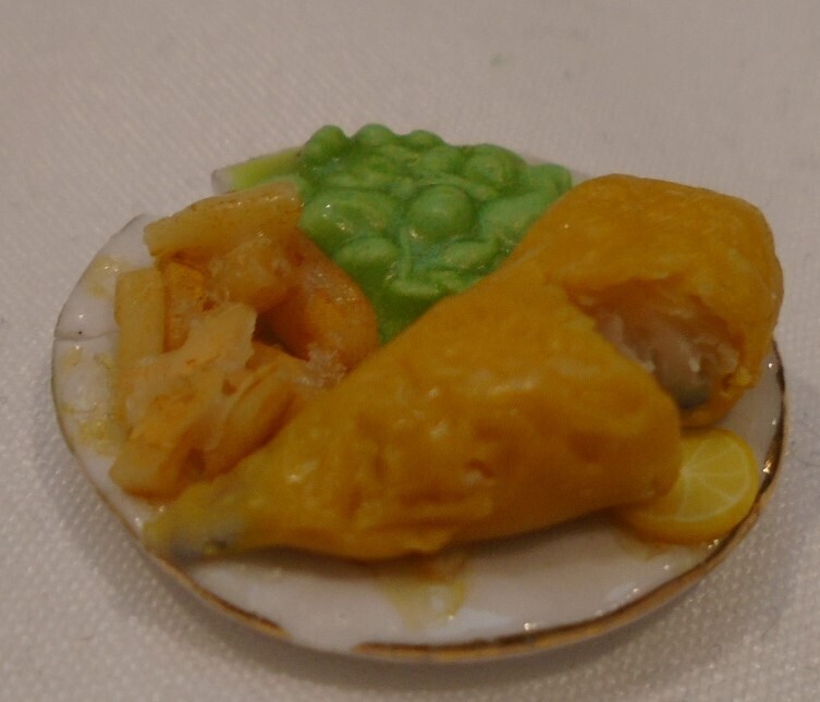 FISH, CHIPS AND MUSHY PEAS ON PLATE