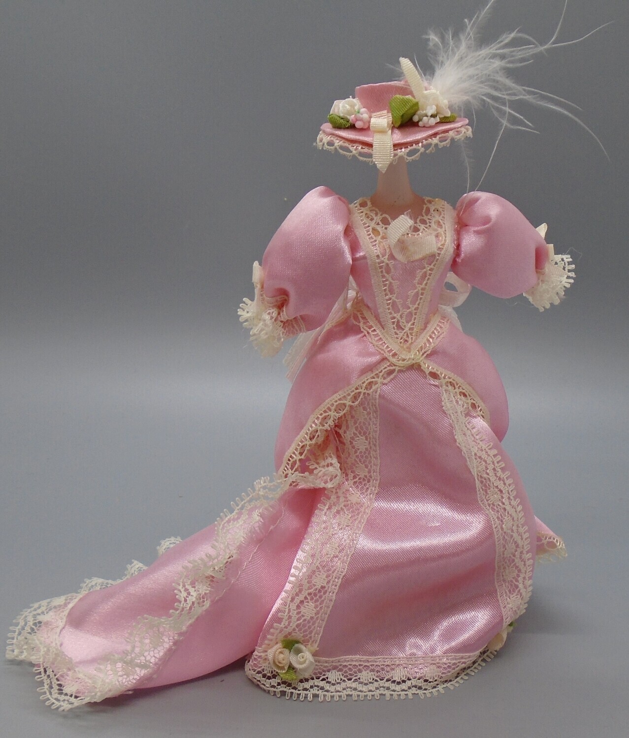 MANNEQUIN IN PINK DRESS AND HAT