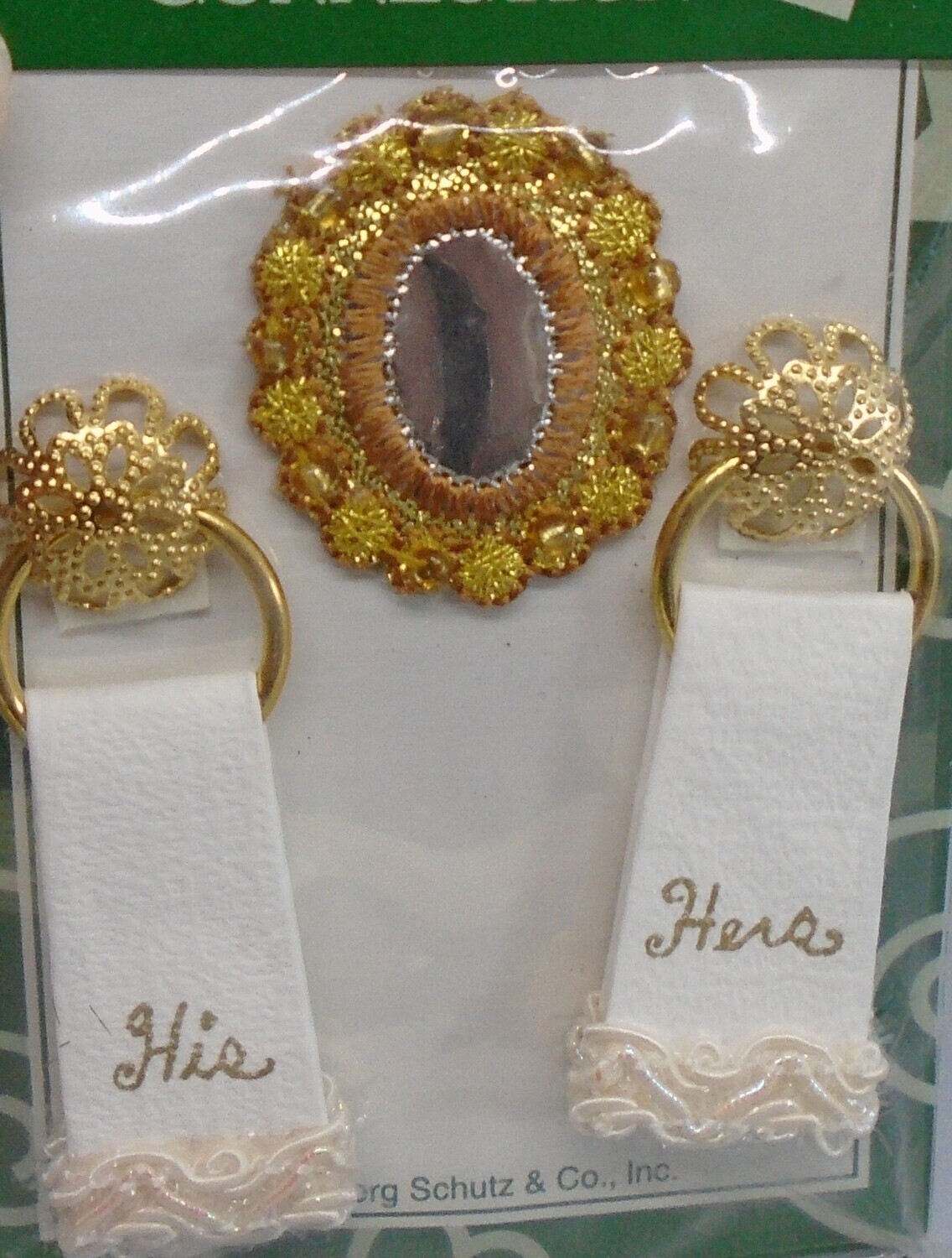 HIS AND HERS TOWELS ON GOLD FIXINGS