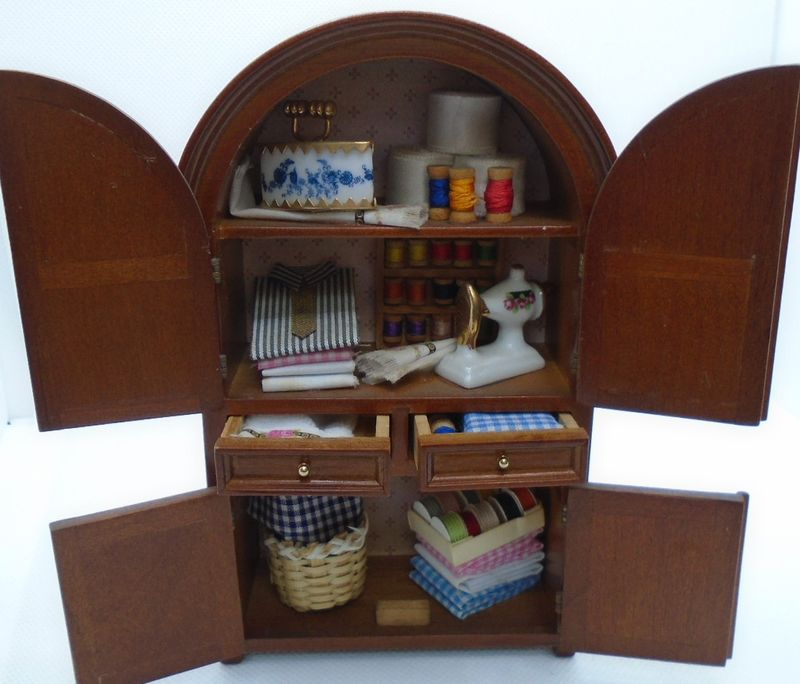 REUTTER FILLED CUPBOARD