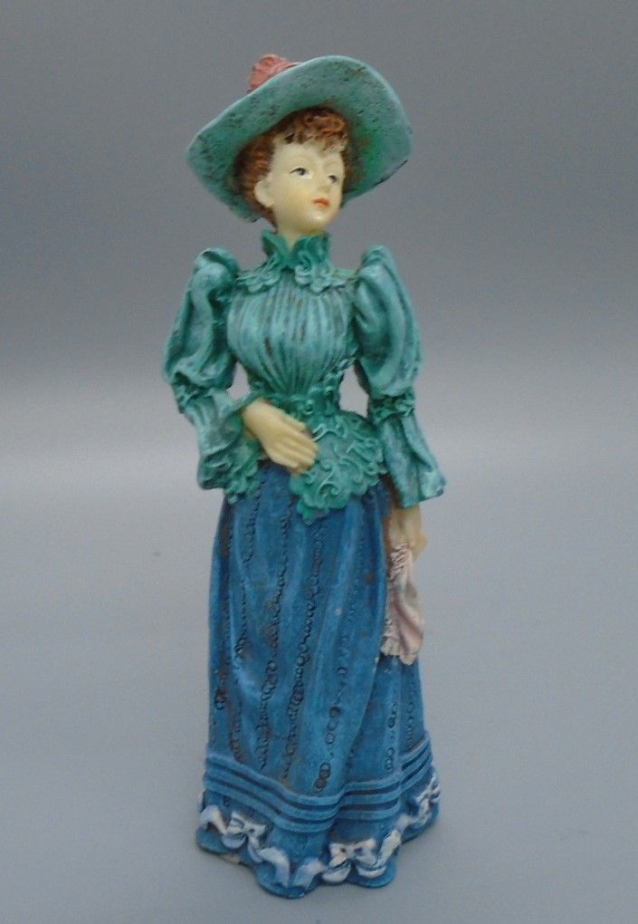LADY IN GREEN TOP AND HAT
