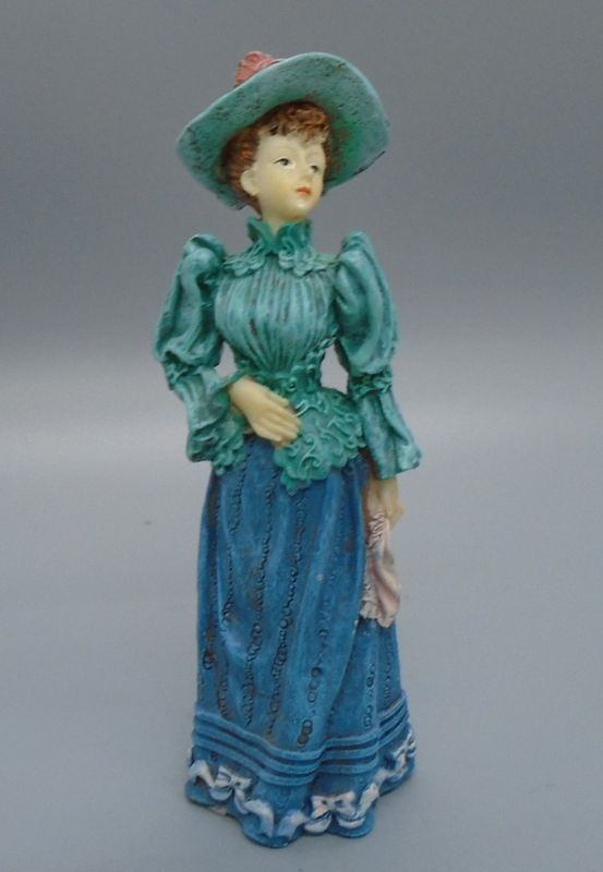LADY IN GREEN TOP AND HAT
