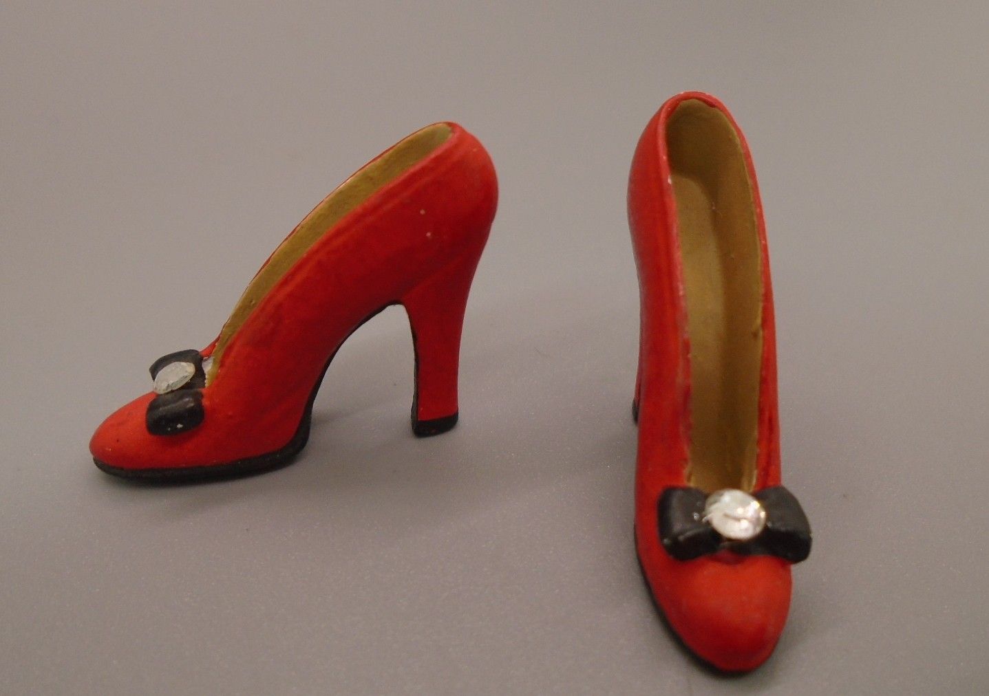 PAIR OF HIGH HEELED RED SHOES PAIR OF HIGH HEELED RED SHOES