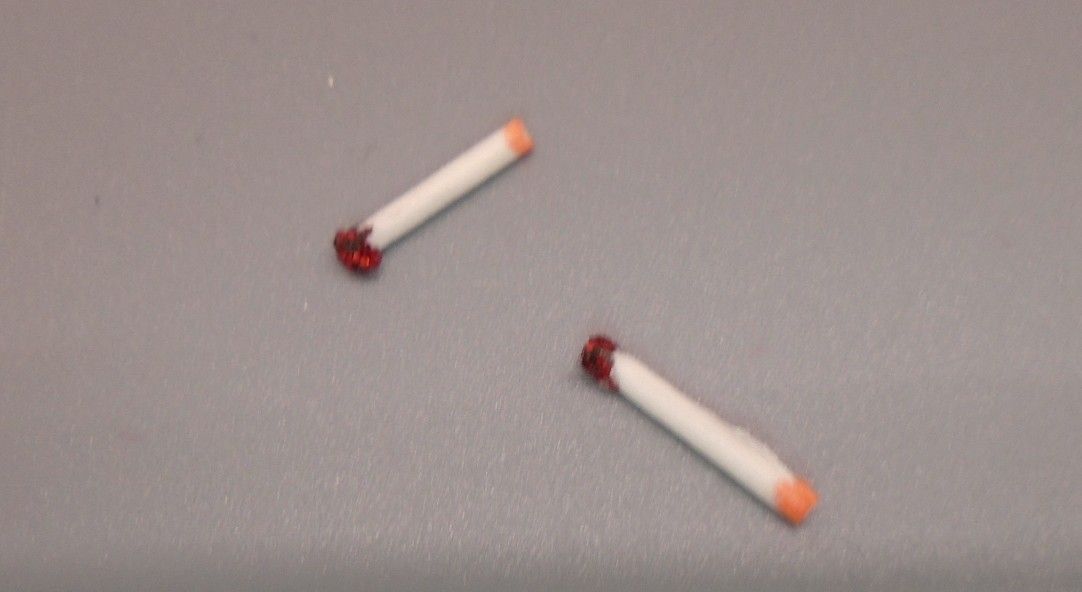 2 LIT CIGARETTES