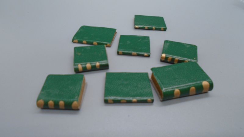 STACK OF HANDCRAFTED BOOKS