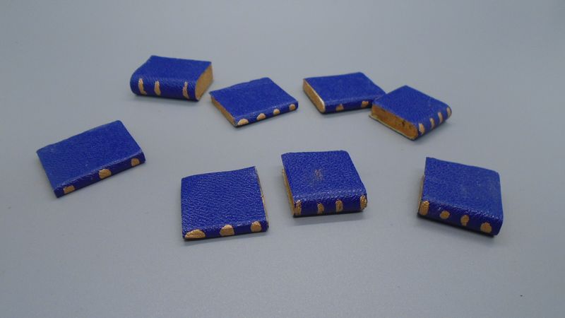 STACK OF HANDCRAFTED BOOKS