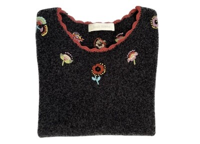 Embroidered Top with scalloped edges.