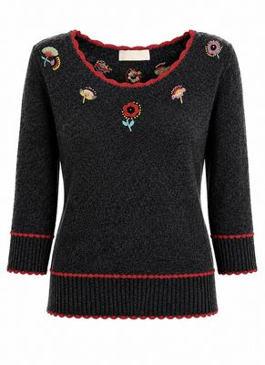 Embroidered Top with scalloped edges.