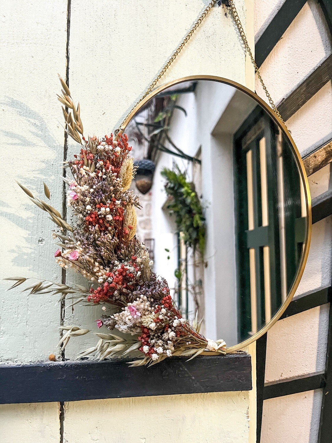 Miroir ovale fleuri en laiton Gênes