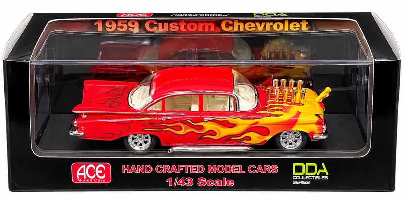 1959 Custom Chevrolet 1:43 scale boxed model car in red with yellow flame graphics, chrome wheels and custom engine detailing