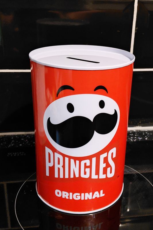 Red pringle tin the type you cut open with a tin opener 15cm high 10cm width