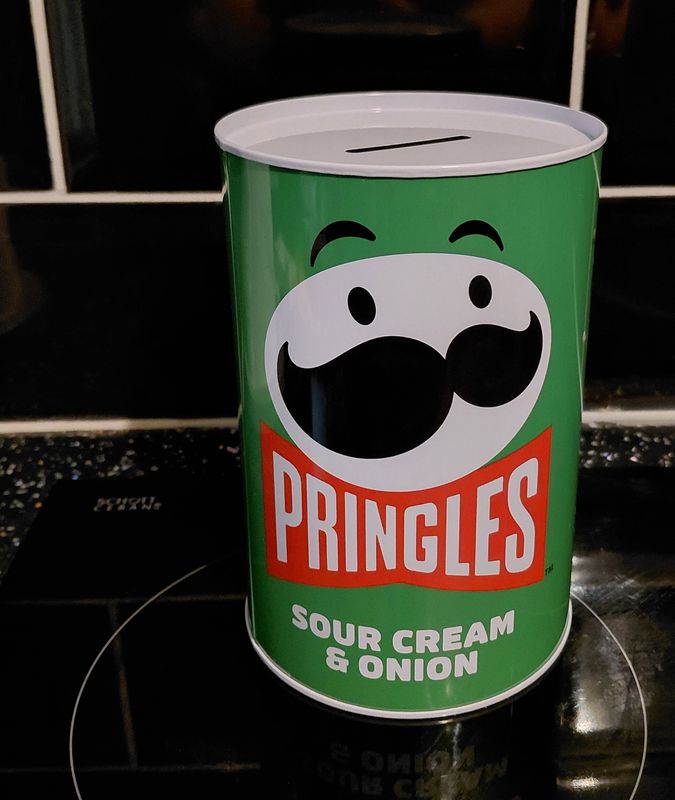 Green pringle tin the type you cut open with a tin opener 15cm high 10cm width