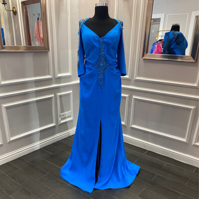 Vestido largo con mangas, color azul en tonalidad turquesa. Talla L