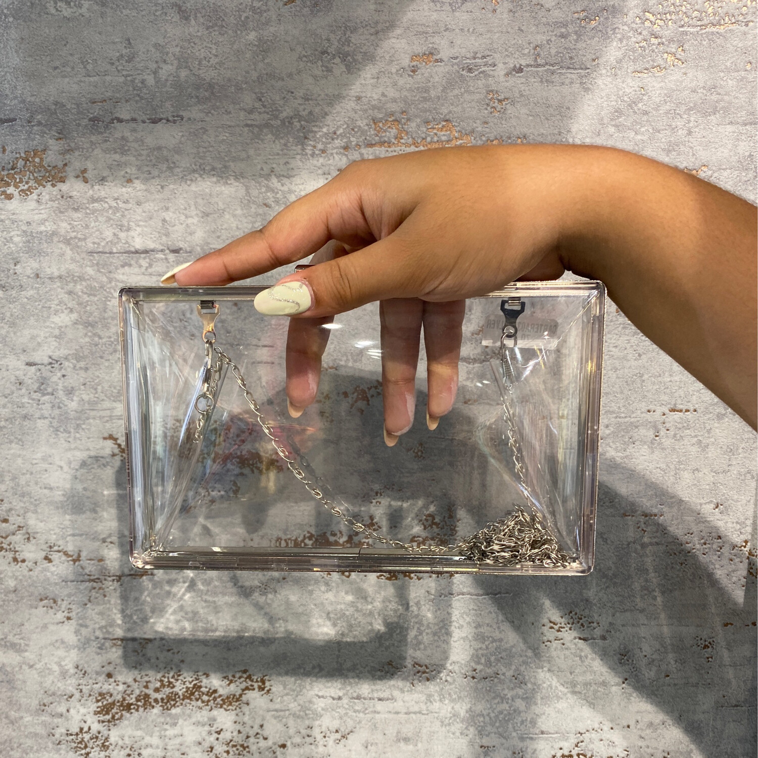 CARTERA DE MANO O CRUZADA - SILVER / TRANSPARENTE