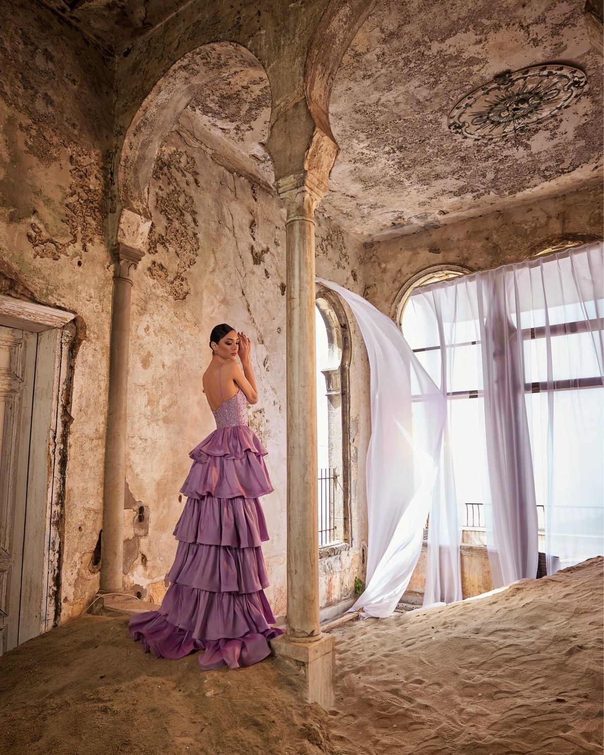 Lilac high-low ruffled gown with a beaded corset bodice