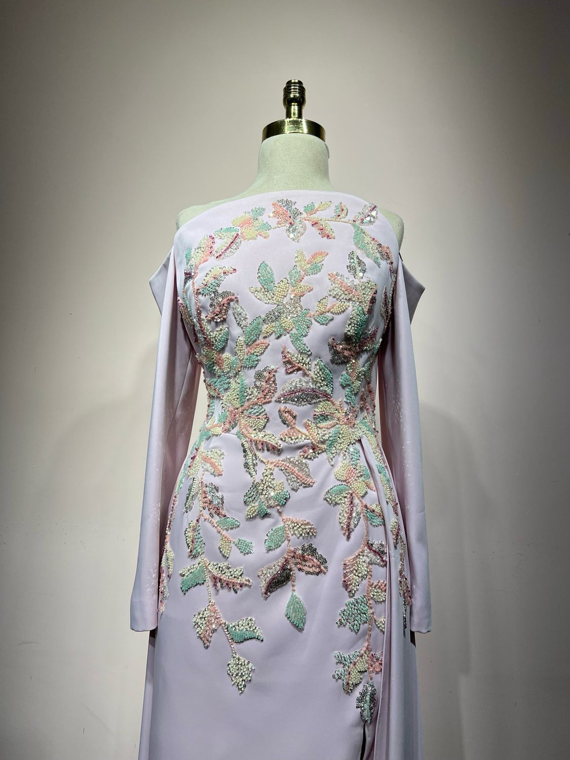 Long-sleeve, off-shoulder mermaid with overskirt drama