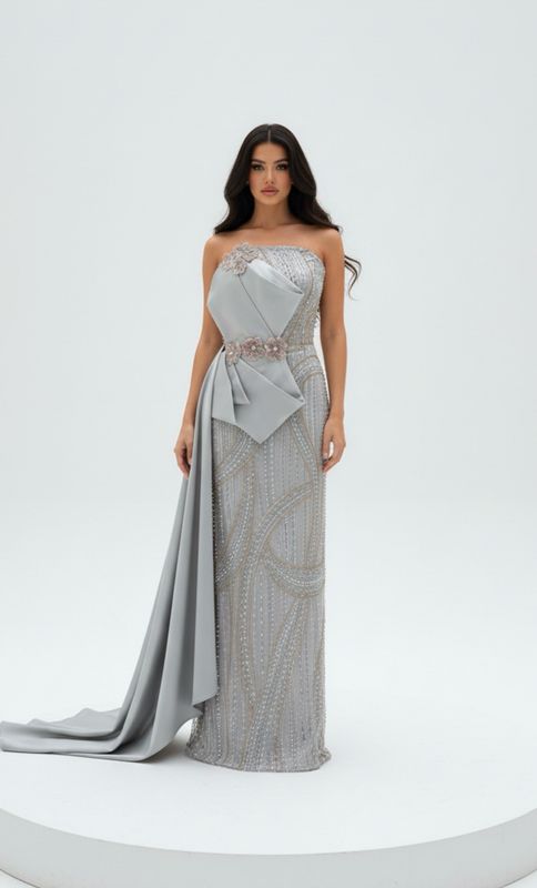 Strapless silver gown with detailed beading, and a soft side drape