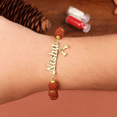Personalized Flute Name Cut Rakhi with Rudraksha Personalized Flute Name Cut Rakhi with Rudraksha