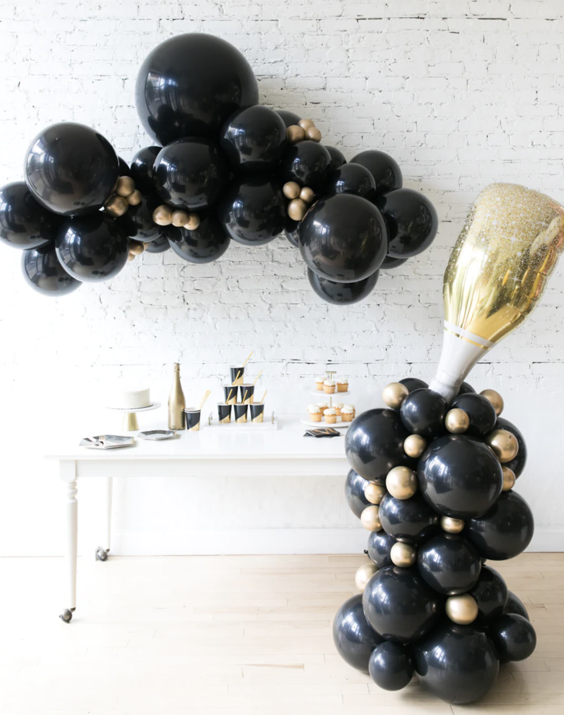 Champagne Bottle Column, Organic Garland Balloon Arch Set. A