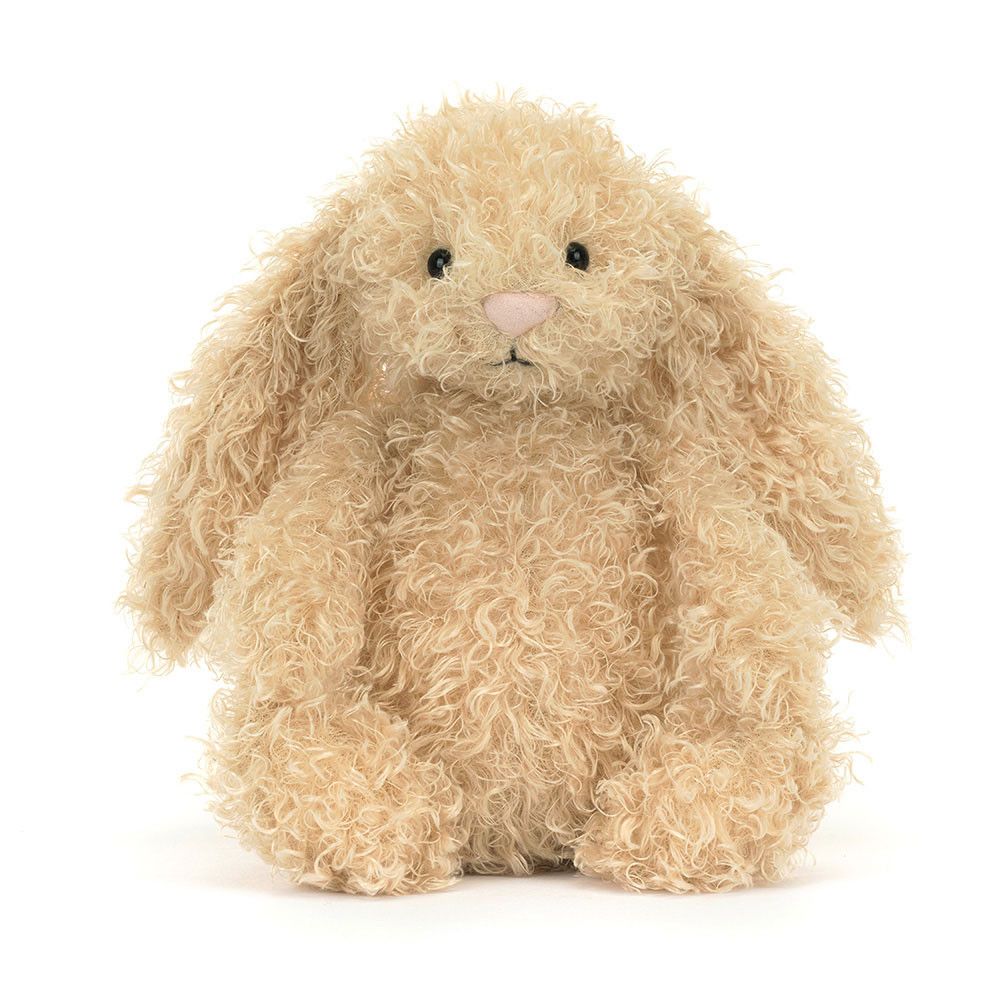 Luxe Bunny Curly 31cm, leicht schräge Ansicht, sitzend mit weichem Lockenfell