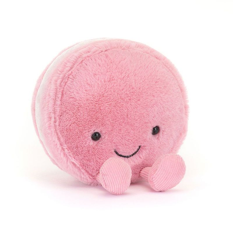 Jellycat Amuseables Mia Macaron, erdbeer-rosa Fell, lächelndem Gesicht & Cordbeinen, leicht schräg