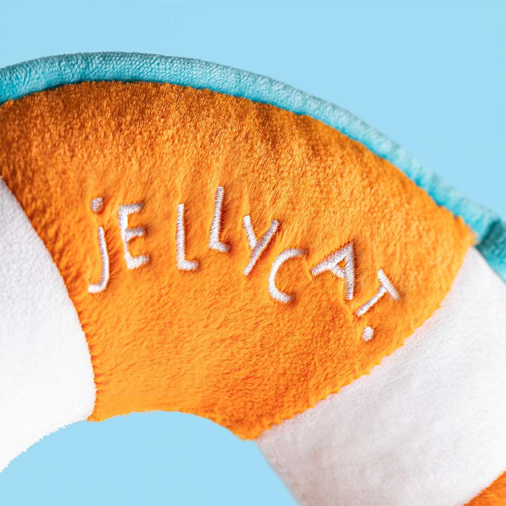 Jellycat Amuseable Rettungsring Plüschtier orange weißer Ring fröhliches Gesicht braune Cord Beine Stofftier Seefahrt  