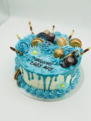 Gender Reveal Cake With Blue Melted Chocolate Topped with macarons, delicious chocolate