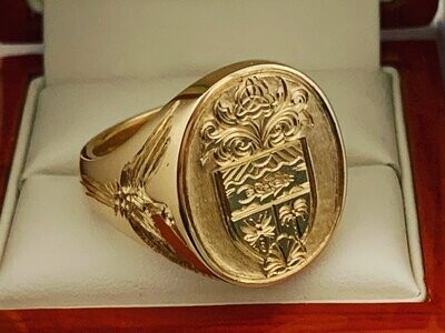 The heavy hand carved in relief “Oxford Bull Signet Ring”
