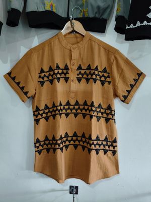Polo. TBOLI HAND- BEADED POLO