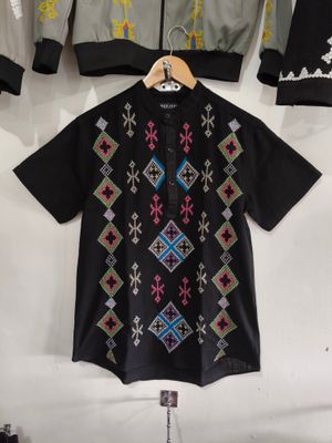 Polo. TBOLI HAND- EMBROIDERED POLO
